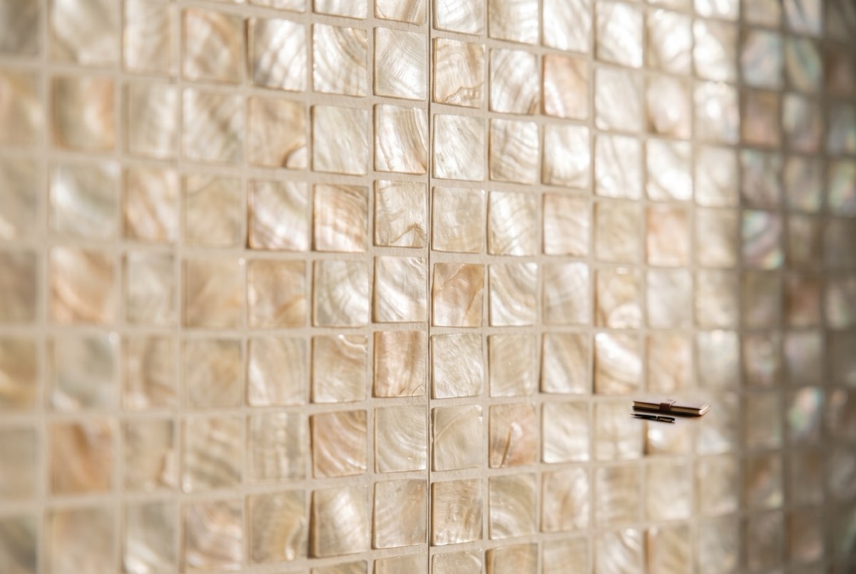 Capiz shell wallcovering detail with hand-set tiles and a butted seam in raking light, Park City, Utah