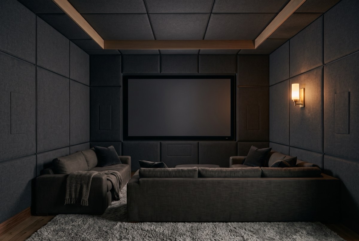 Charcoal wool upholstered acoustic walls and ceiling in a media room, Park City, Utah