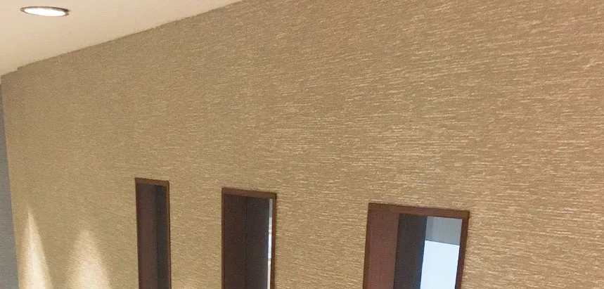 Textured grasscloth wallcovering detail, close-up