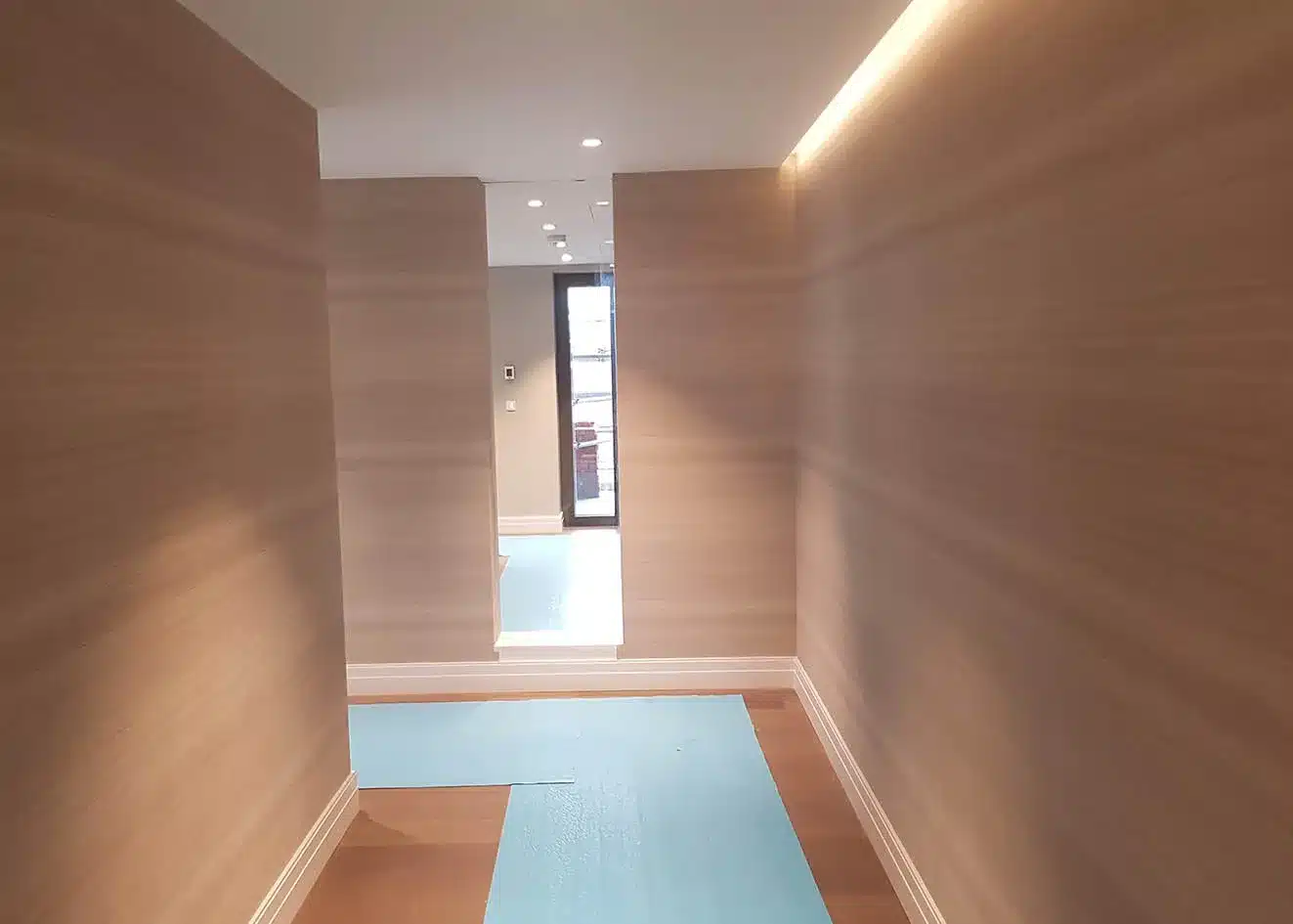 Grasscloth hallway in a new-construction luxury residence, Utah
