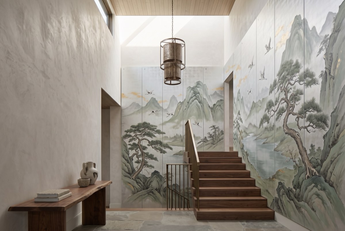 Hand-painted mountain scenic panels rising a double-height entry hall, Promontory, Utah