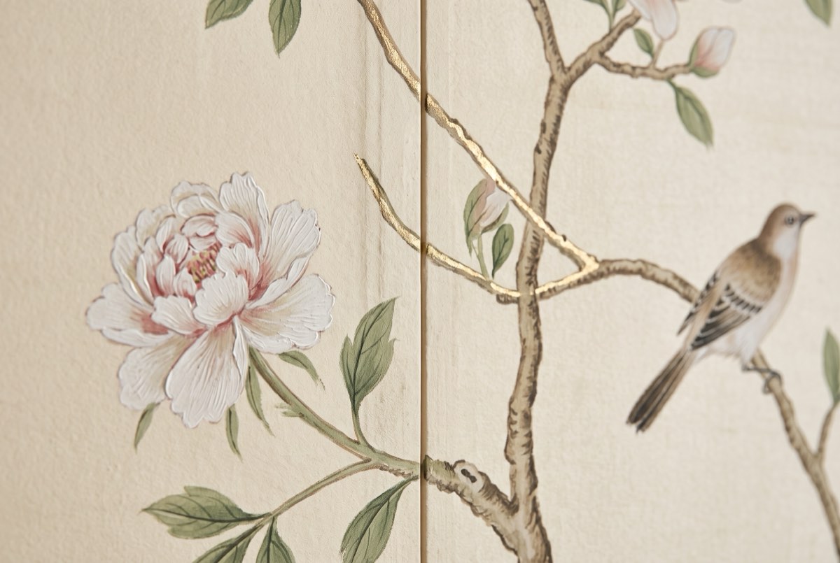 Hand-painted wallcovering detail with visible brushwork, gold leaf, and a panel join, Park City, Utah