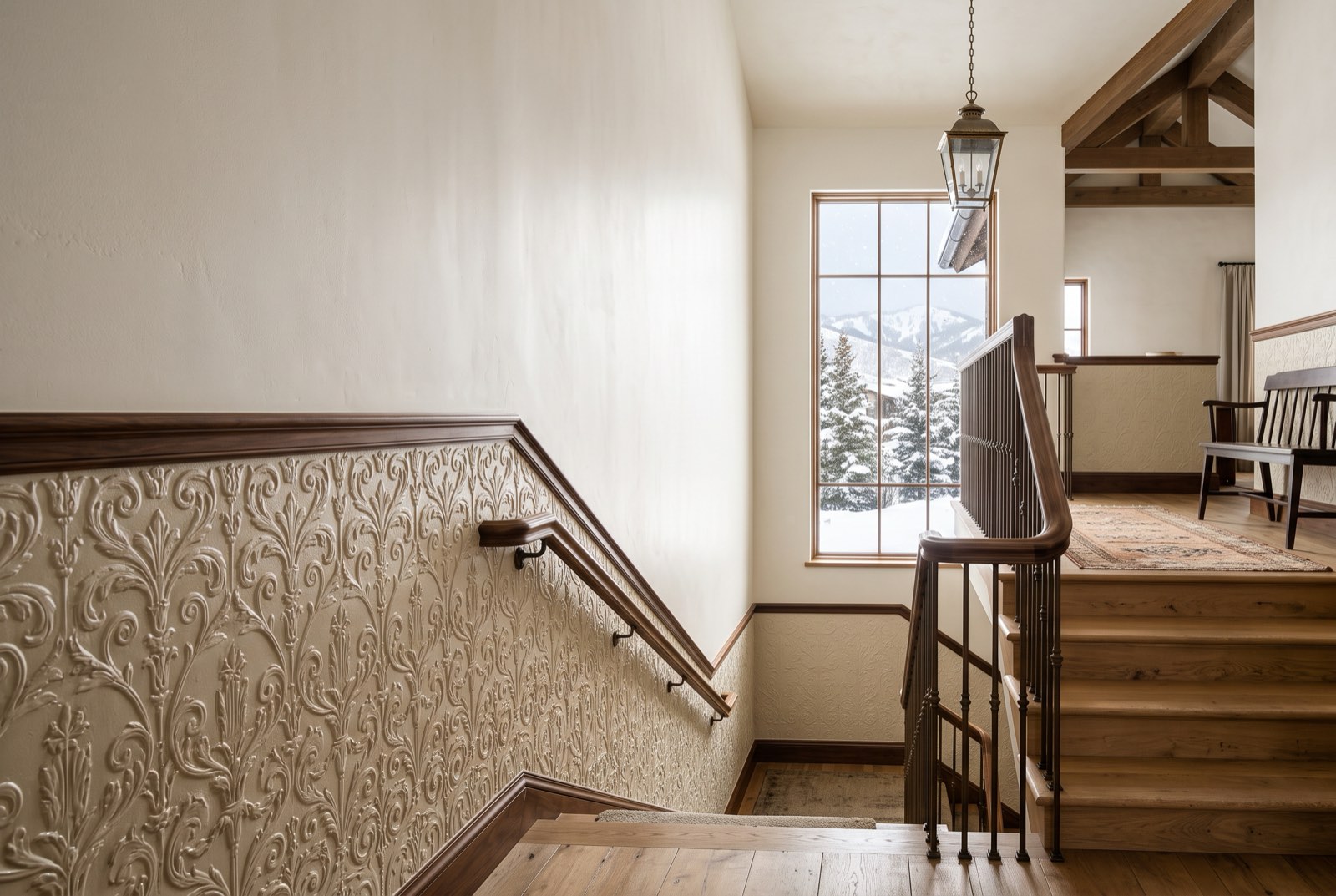 Painted embossed relief dado below a chair rail along a stair hall, Park City, Utah