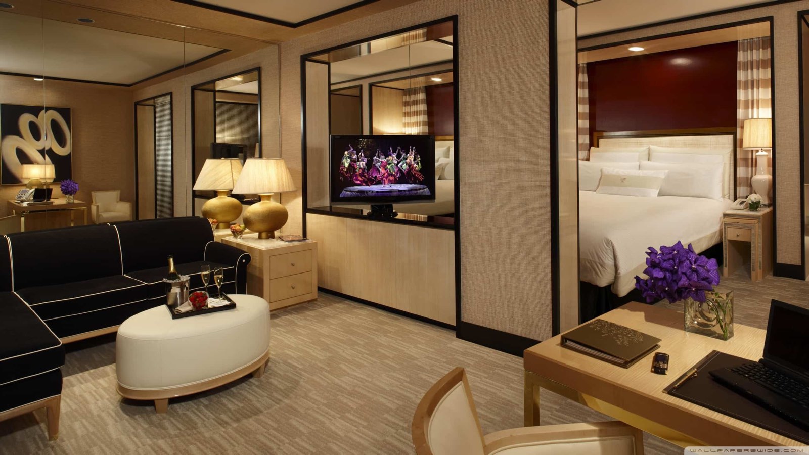 Contract wallcovering across a luxury hotel suite bedroom and living area, installed by Mancini Wallpapers