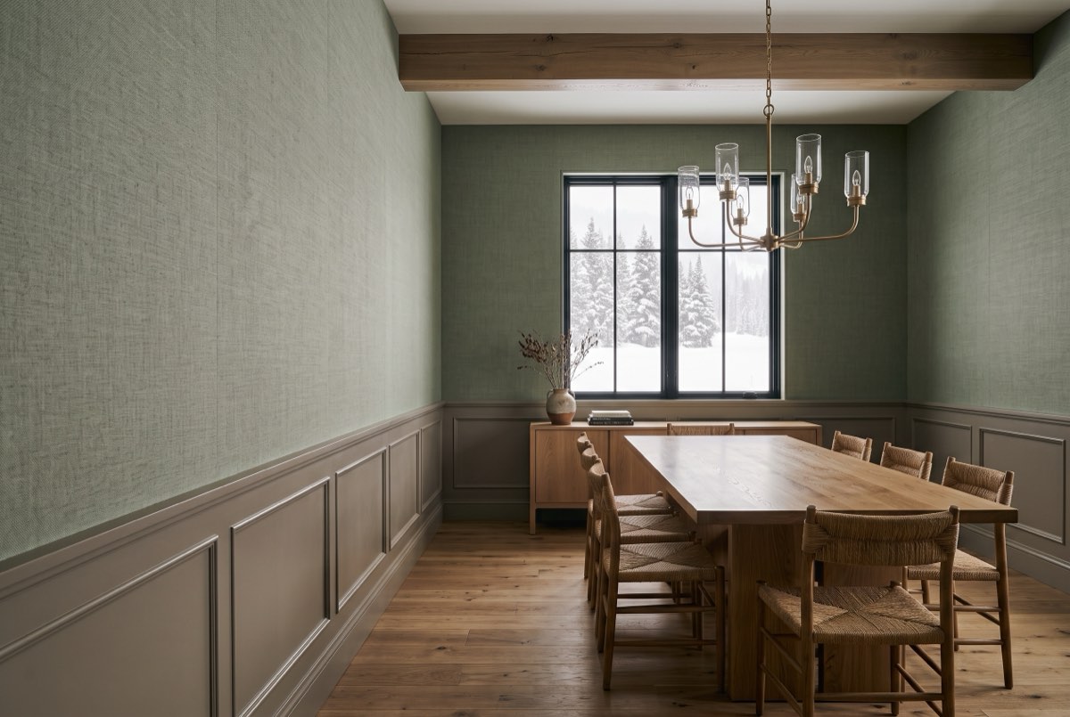 Sage linen textile wallcovering above a painted wainscot in a dining room, Heber Valley, Utah