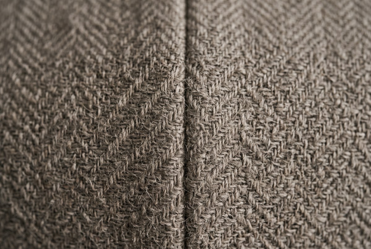 Woven wool textile wallcovering weave in raking light with a butted seam, Park City, Utah